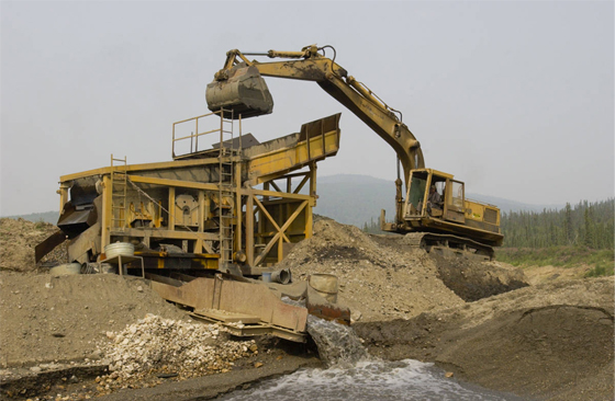 Figure shows an excavator and washing machine for placer gold mining.jpg